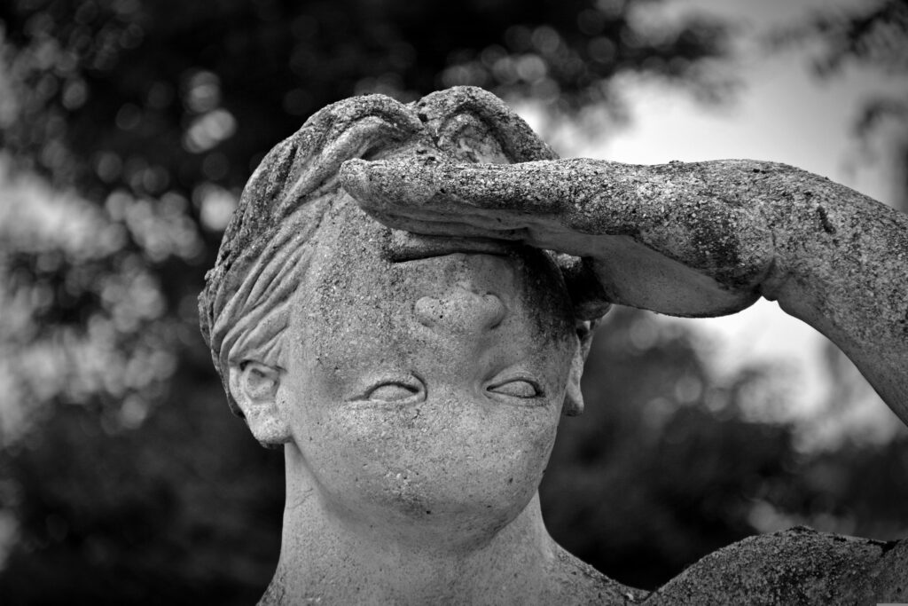human statue with head attached upside down