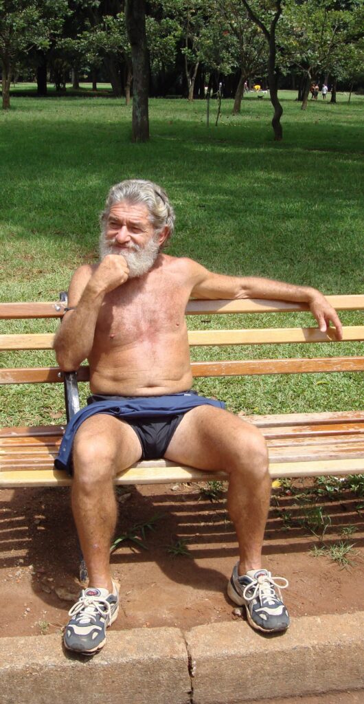 runner resting on park bench