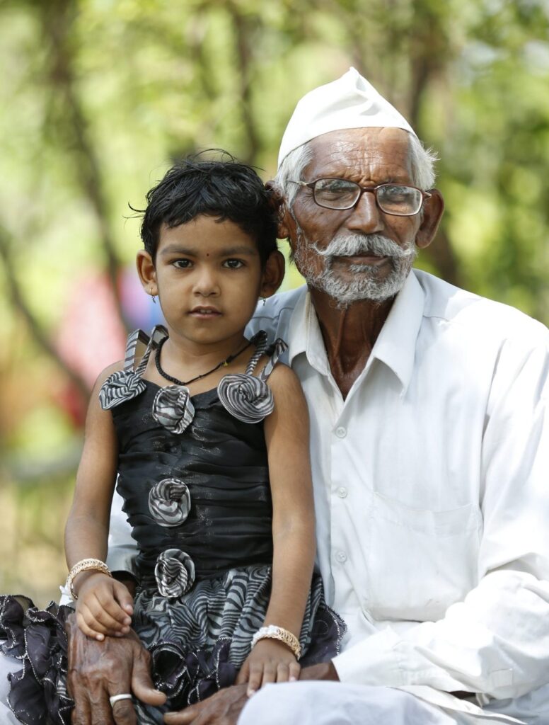 Elder man with little girl